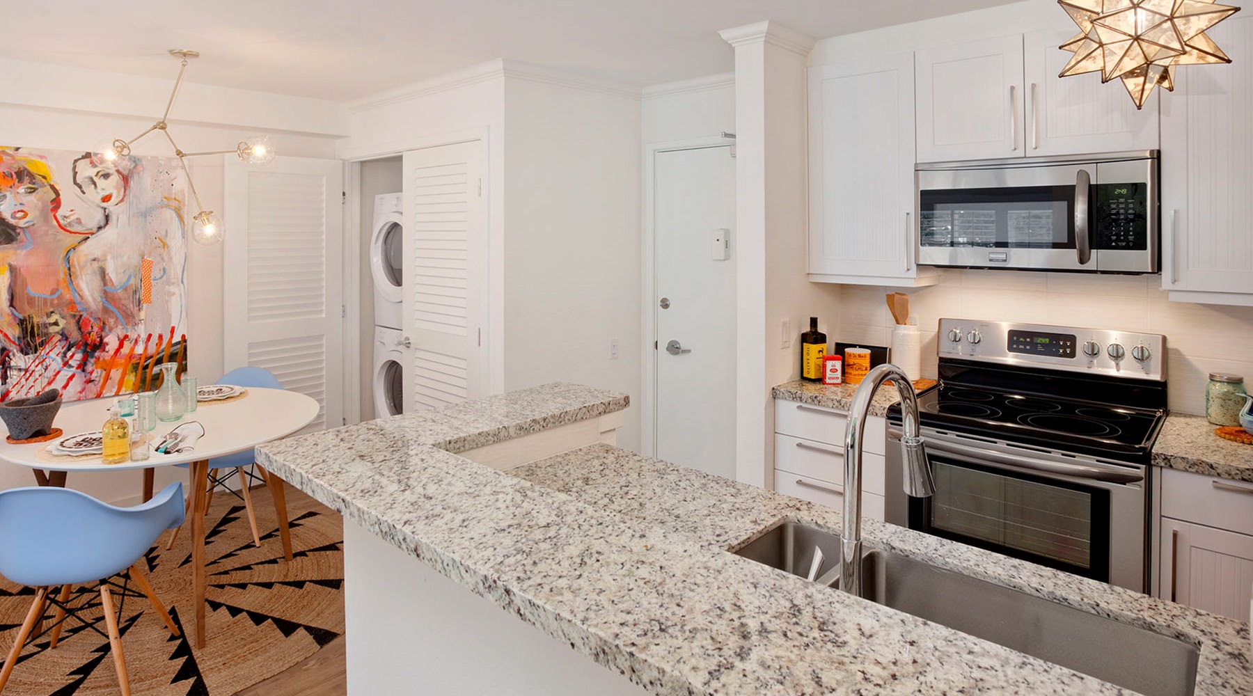 kitchen with stainless steel appliances and white cabinets